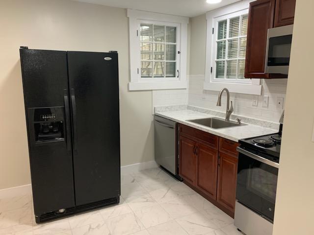 The kitchen and window in apartment 6 at 1264 Cherokee Road